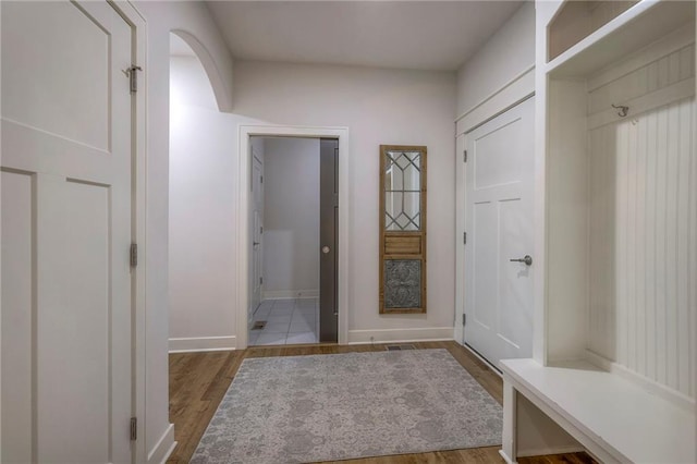 mudroom with hardwood / wood-style floors