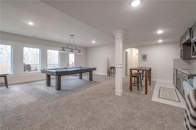 game room featuring light colored carpet, sink, pool table, and decorative columns