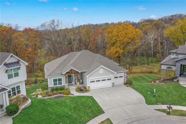 view of front of property featuring a garage and a front yard