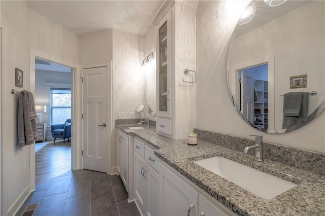 bathroom with vanity and hardwood / wood-style floors