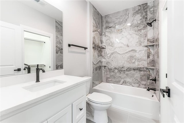 full bathroom with vanity, toilet, and tiled shower / bath