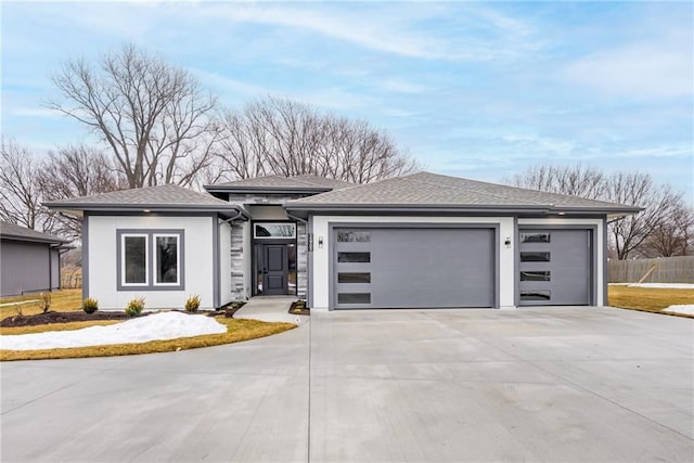 prairie-style home featuring a garage