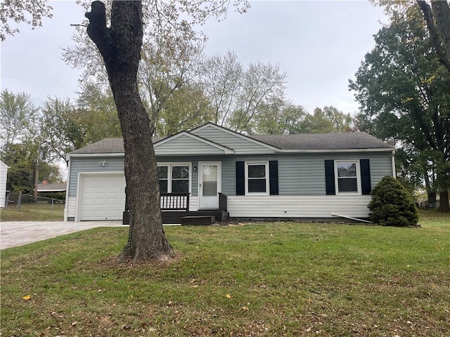 single story home with a front yard and a garage