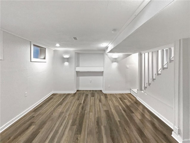 basement featuring dark hardwood / wood-style floors