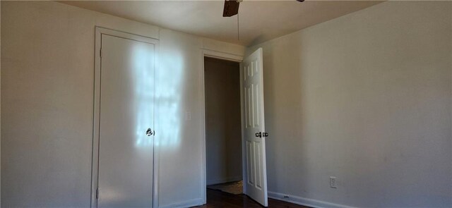 unfurnished bedroom featuring ceiling fan