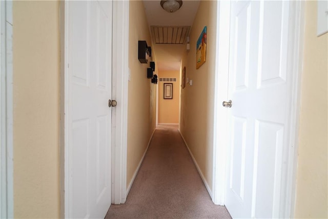 hallway featuring light carpet