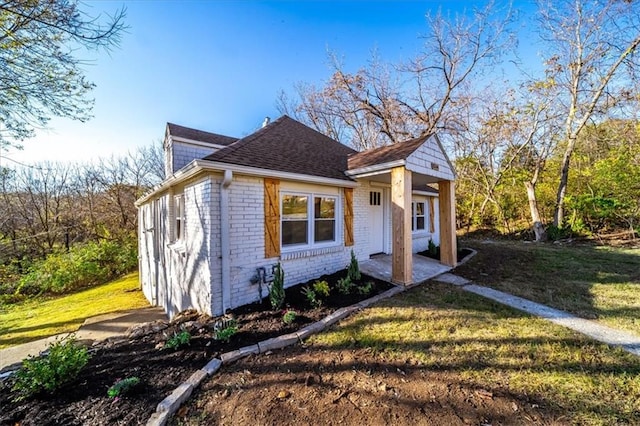 bungalow with a front yard