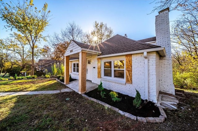 view of property exterior with a yard