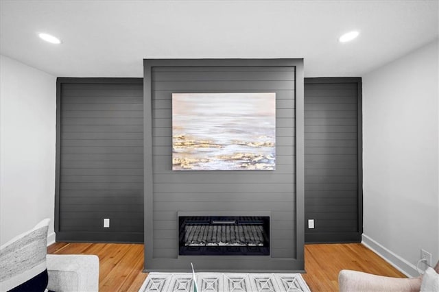 interior details with a fireplace and hardwood / wood-style flooring