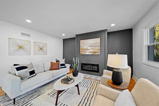 living room featuring hardwood / wood-style floors and a fireplace