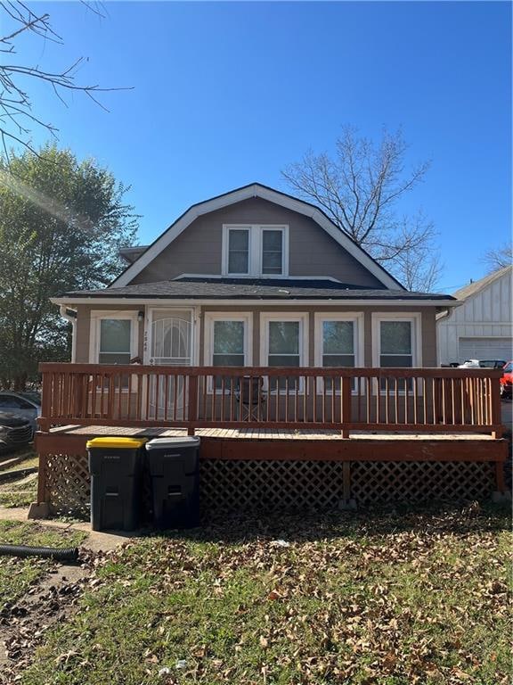 back of house featuring a deck