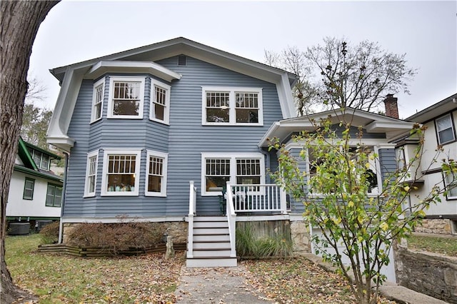 5635 Locust St, Kansas City, MO 64110 - view of front of house featuring central air condition unit