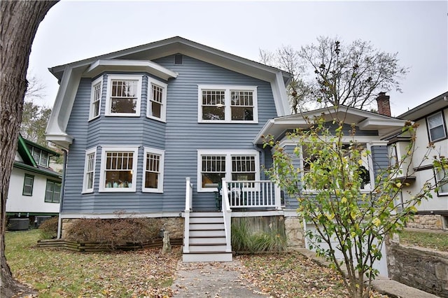 view of front of house featuring central air condition unit