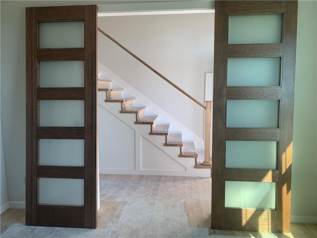 422 Victory Cir, Kearney, MO 64060 - staircase featuring baseboards and wood finished floors