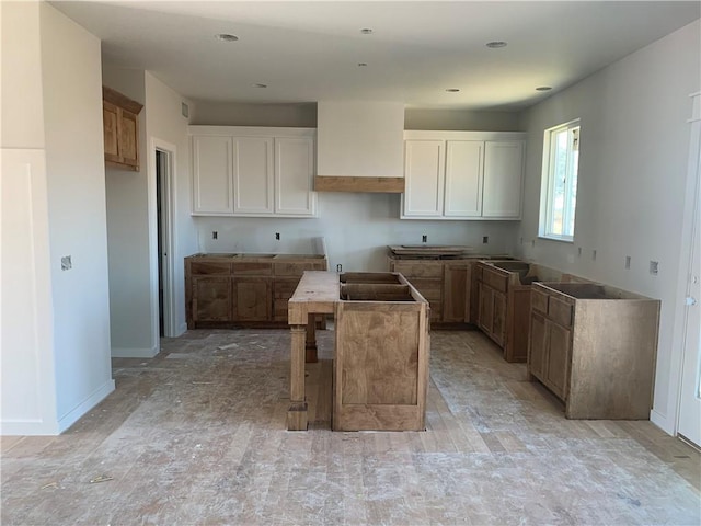 kitchen with white cabinetry and a kitchen island