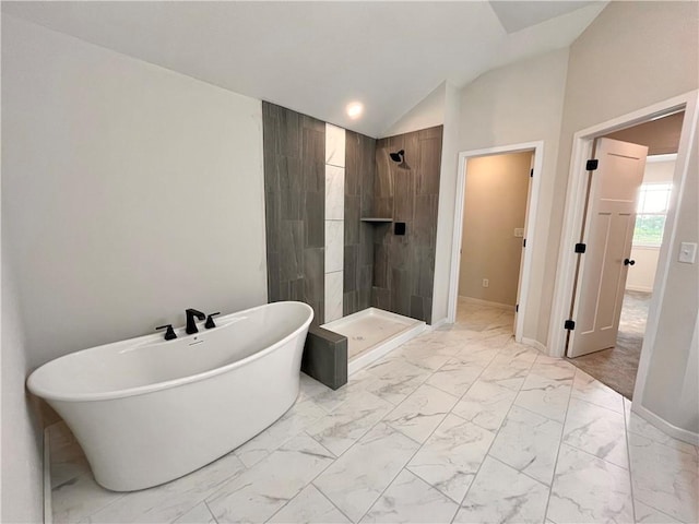 422 Victory Cir, Kearney, MO 64060 - full bath featuring marble finish flooring, a tile shower, a freestanding tub, vaulted ceiling, and baseboards
