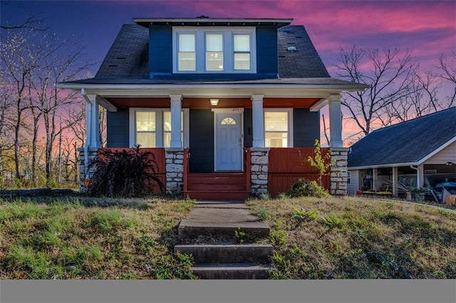 view of front of property featuring covered porch