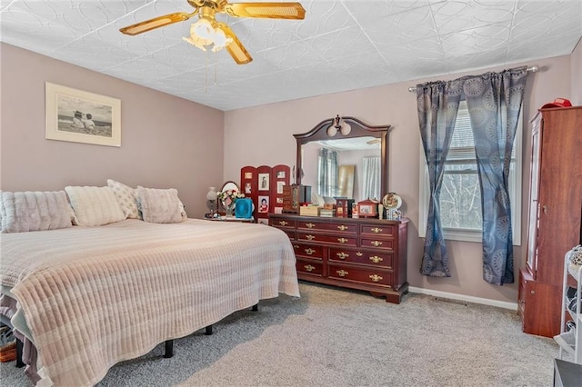 bedroom with light colored carpet and ceiling fan