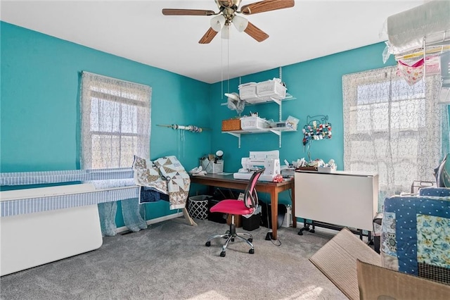 carpeted office with ceiling fan