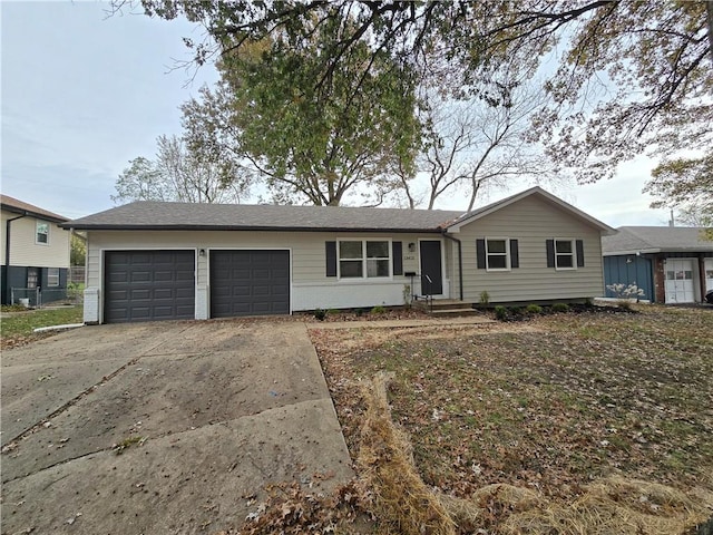 ranch-style house featuring a garage