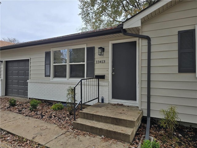 doorway to property featuring a garage