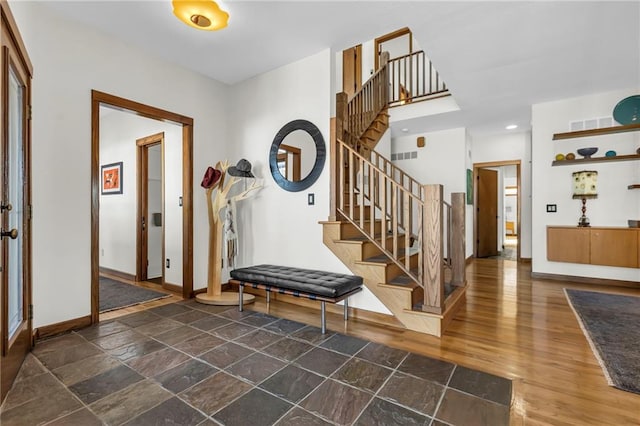 32225 W 88th St, De Soto, KS 66018 - entrance foyer featuring recessed lighting, stairs, stone finish floor, and baseboards