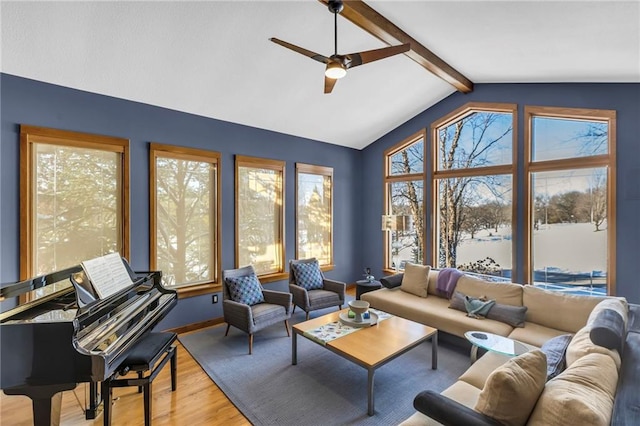 32225 W 88th St, De Soto, KS 66018 - living area featuring plenty of natural light, ceiling fan, vaulted ceiling with beams, and wood finished floors