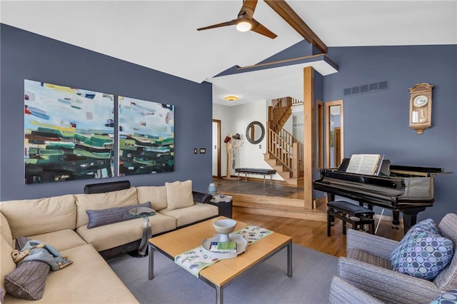 32225 W 88th St, De Soto, KS 66018 - living area featuring ceiling fan, high vaulted ceiling, visible vents, stairway, and wood finished floors