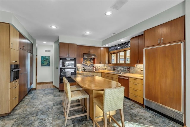 32225 W 88th St, De Soto, KS 66018 - kitchen with tasteful backsplash, under cabinet range hood, visible vents, stainless steel dishwasher, and paneled refrigerator