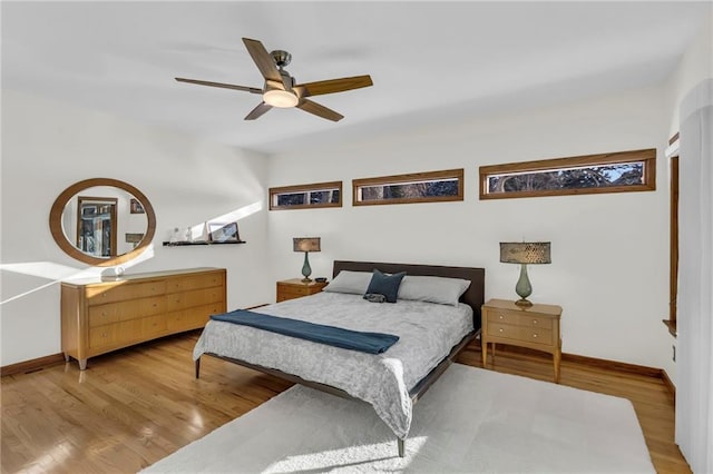 32225 W 88th St, De Soto, KS 66018 - bedroom with wood finished floors, baseboards, and a ceiling fan