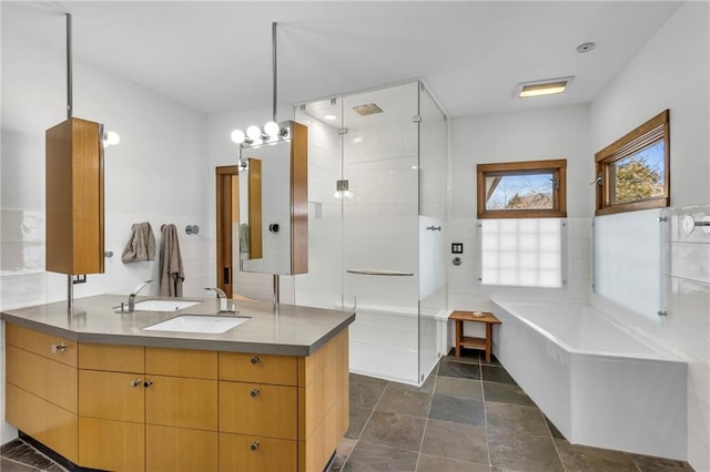 32225 W 88th St, De Soto, KS 66018 - bathroom with a shower stall, a garden tub, stone finish floor, and vanity