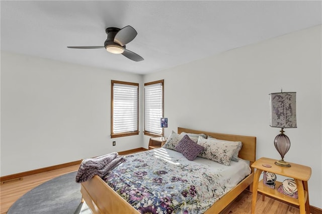 32225 W 88th St, De Soto, KS 66018 - bedroom featuring visible vents, baseboards, ceiling fan, and wood finished floors