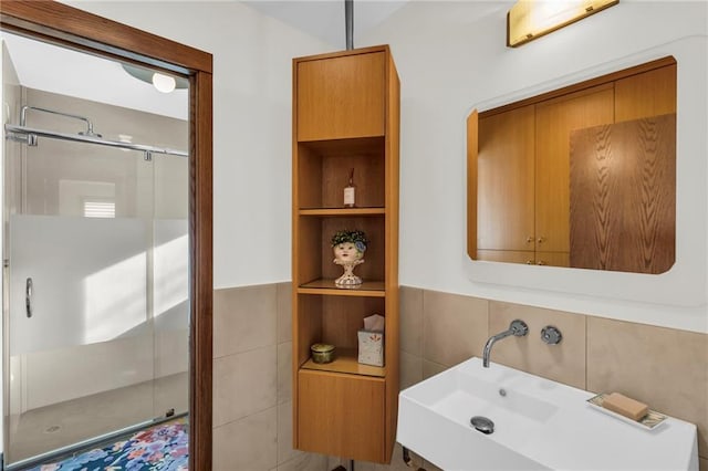 32225 W 88th St, De Soto, KS 66018 - bathroom featuring a shower stall, tile walls, and a sink