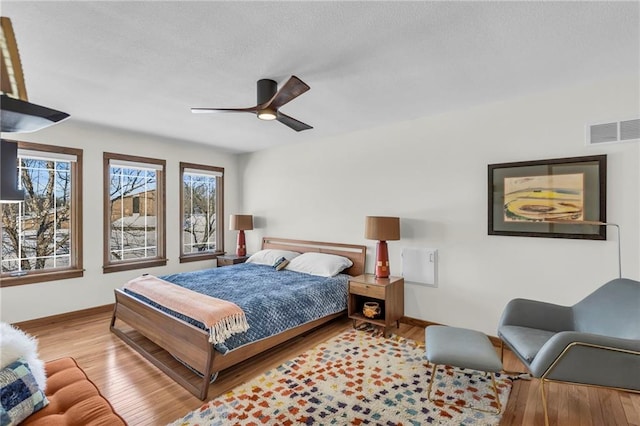 32225 W 88th St, De Soto, KS 66018 - bedroom with ceiling fan, visible vents, baseboards, and wood finished floors