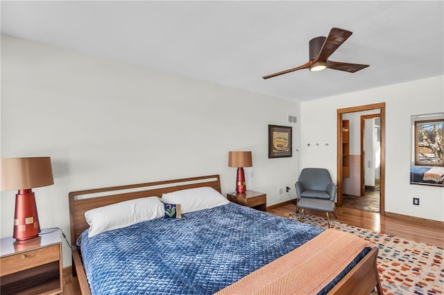 32225 W 88th St, De Soto, KS 66018 - bedroom with wood finished floors, baseboards, a ceiling fan, and visible vents