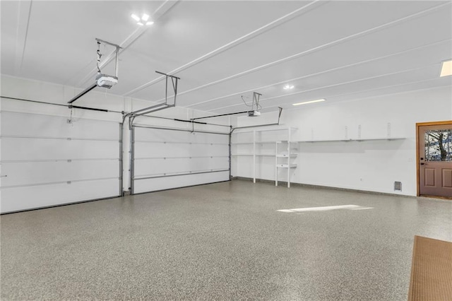 32225 W 88th St, De Soto, KS 66018 - garage featuring baseboards and a garage door opener