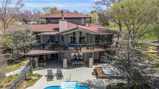 32225 W 88th St, De Soto, KS 66018 - rear view of house featuring a fenced in pool, a patio area, stucco siding, and fence