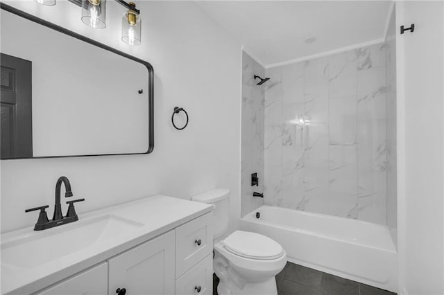 full bathroom with tile patterned floors, vanity, toilet, and tiled shower / bath combo