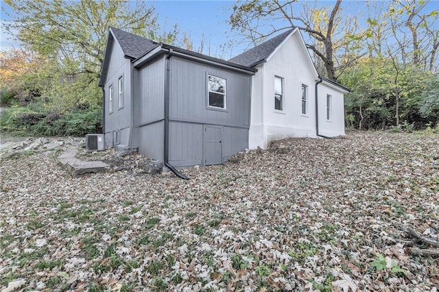 view of property exterior with central AC