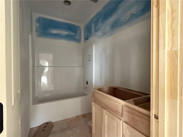 bathroom with shower / washtub combination