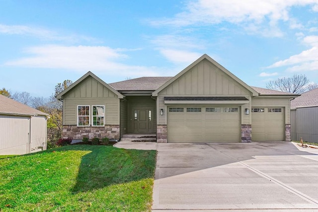 craftsman house featuring driveway, an attached garage, board and batten siding, and stone siding