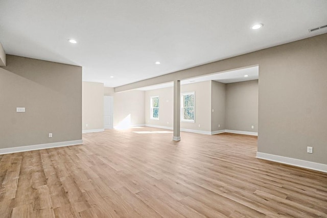 basement featuring recessed lighting, visible vents, baseboards, and light wood-style flooring