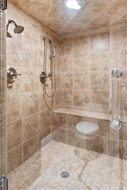 bathroom with tiled shower