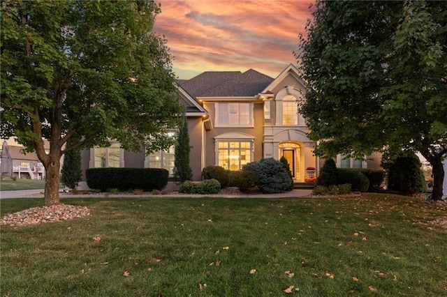 view of front of home with a lawn