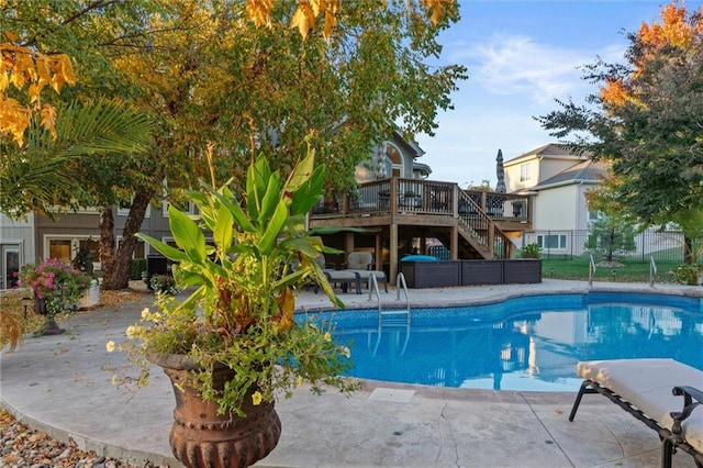 view of pool featuring a deck and a patio