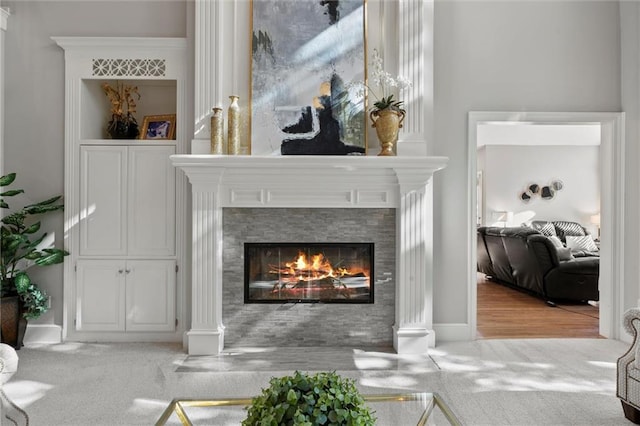 interior space featuring carpet flooring and a fireplace