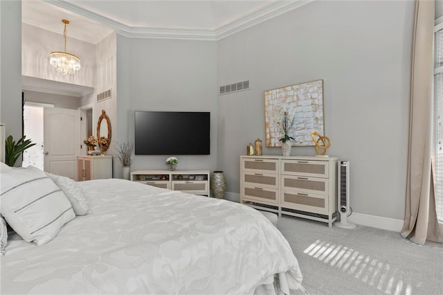 bedroom with carpet flooring, ornamental molding, and a notable chandelier