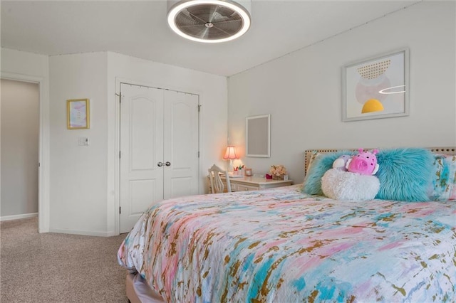 carpeted bedroom featuring a closet