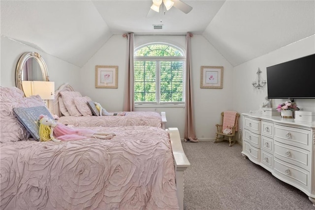 carpeted bedroom featuring ceiling fan and vaulted ceiling