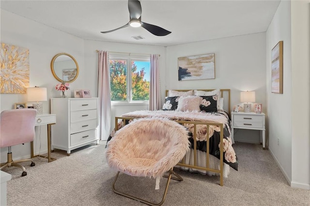 bedroom featuring light carpet and ceiling fan